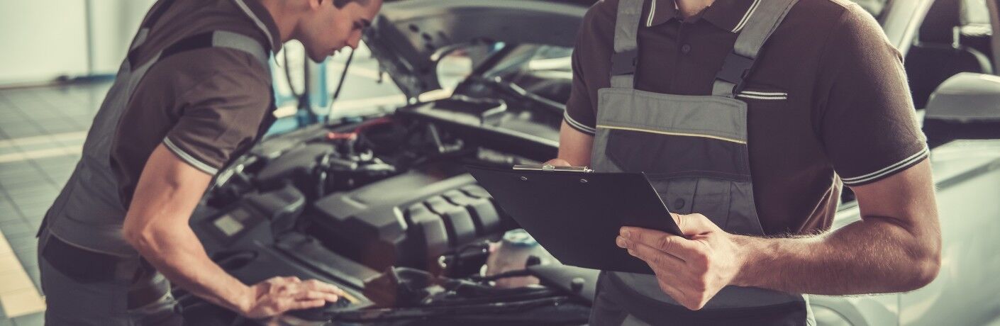 Service Technicians over Vehicle
